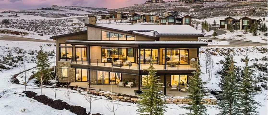 Three-level rear elevation of 3914 Firestar Court in snow